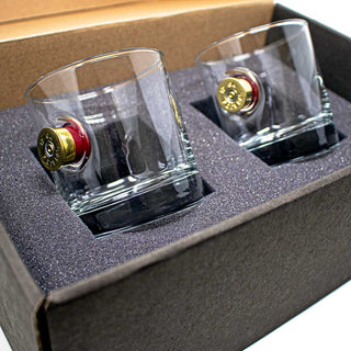 BenShot shotgun shell glasses in a gift box, featuring two clear glasses with red and gold shotgun shell accents.