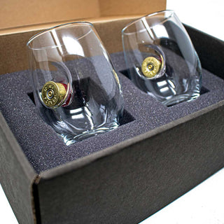 BenShot shotgun shell glasses in a gift box with foam padding, featuring gold-colored bullet casings on the side.