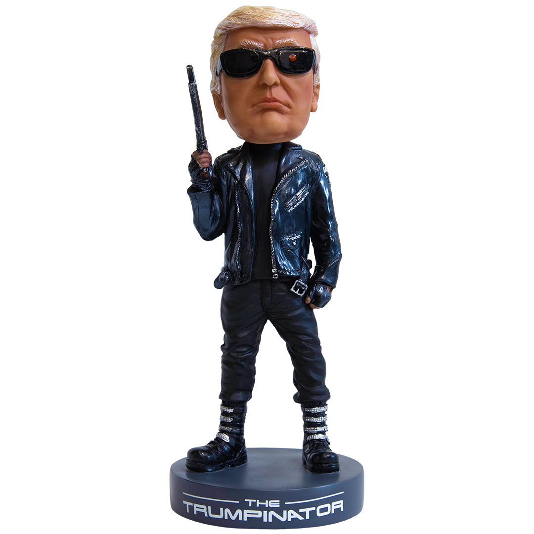 Trumpinator bobblehead featuring a figure in sunglasses and a black leather jacket, holding a gun, on a round base.